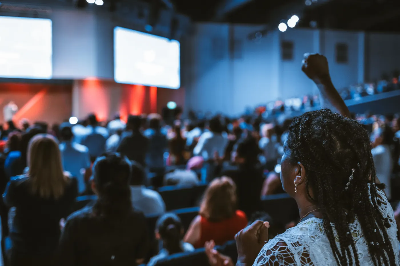 Speaker presenting on a large technology conference stage